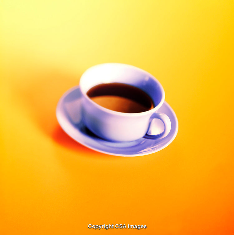 Bright Cup of Coffee on Vibrant Orange Background