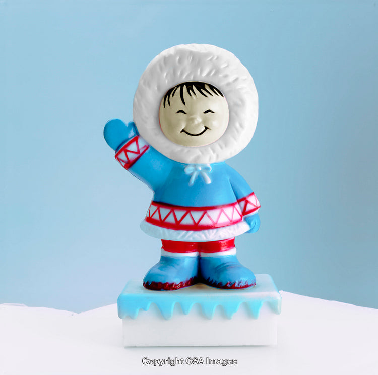 Smiling Arctic Toy Figure Wearing Winter Garments on a Light Blue Background