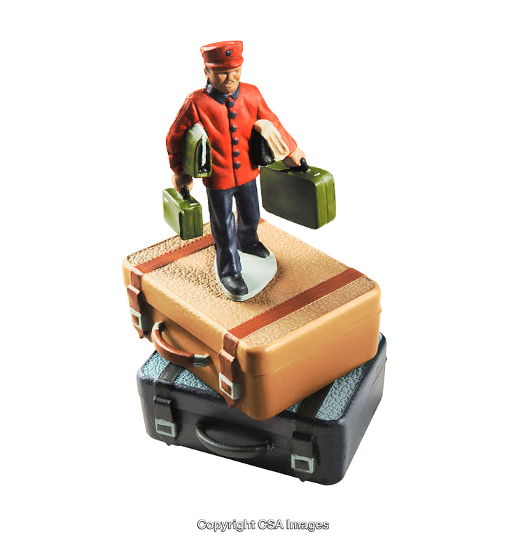Miniature Bellhop Figurine Carrying Luggage on Stack of Suitcases