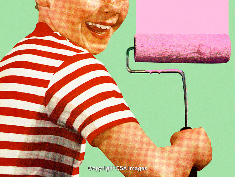 Cheerful Child Painting With Roller on a Vibrant Green Background