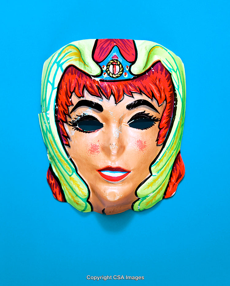 Colorful Vintage Mask Against Bright Blue Background in Close-Up View
