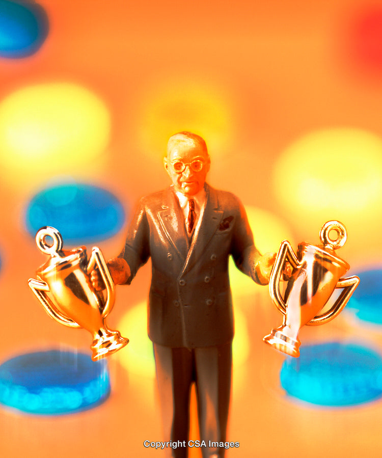 A Model Figurine Holding Golden Trophies with Vibrant Background