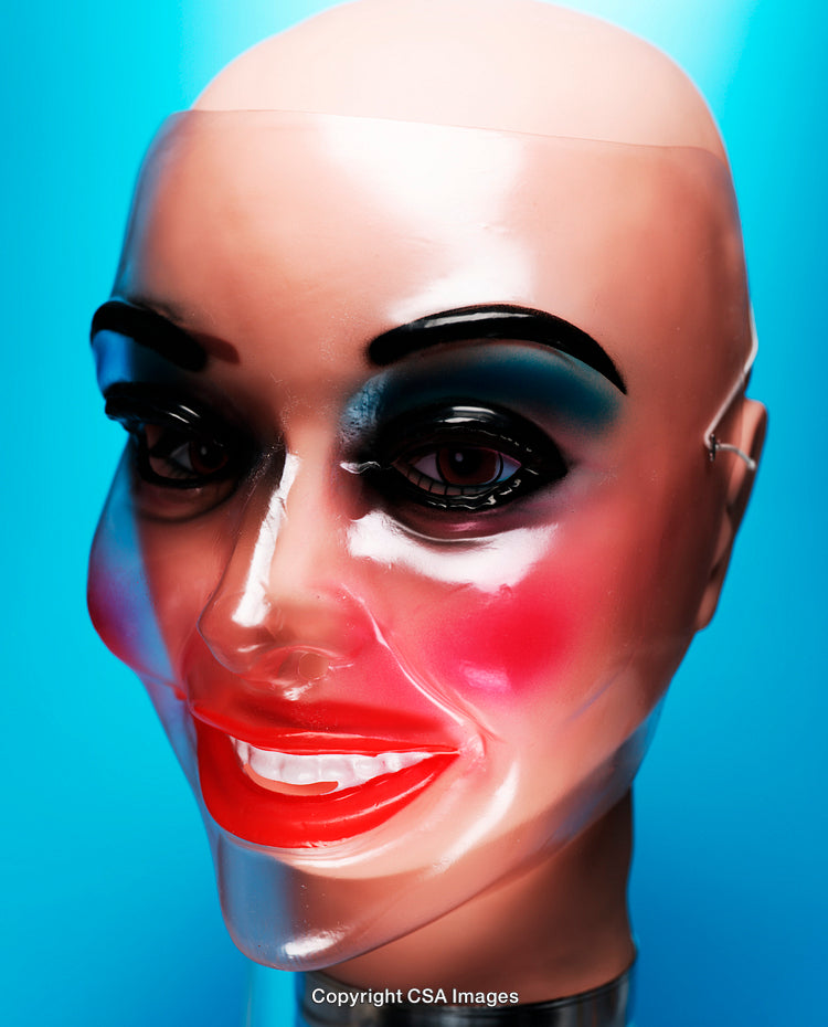 Close-Up Shot of a Vibrant Expressive Plastic Mask on Bright Background