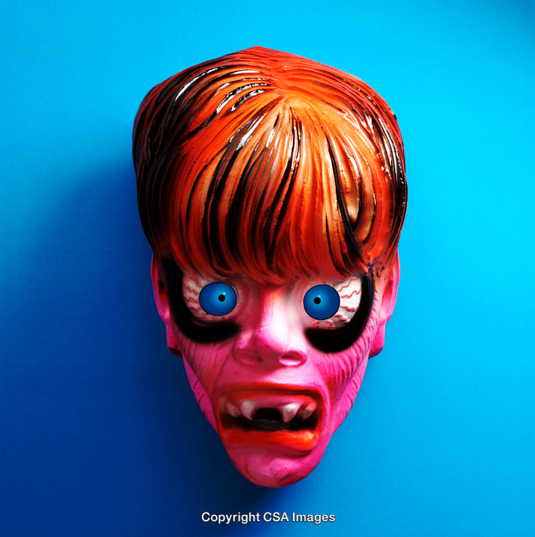 Vibrant Plastic Toy Mask Against Bold Blue Background