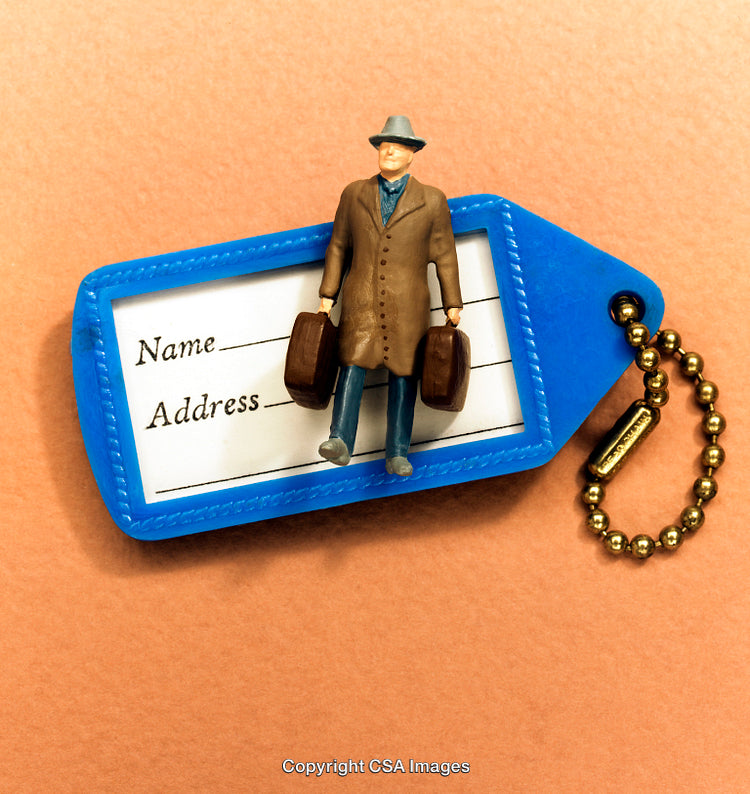 Miniature Traveler Figurine on a Blue Luggage Tag with Name Address Label