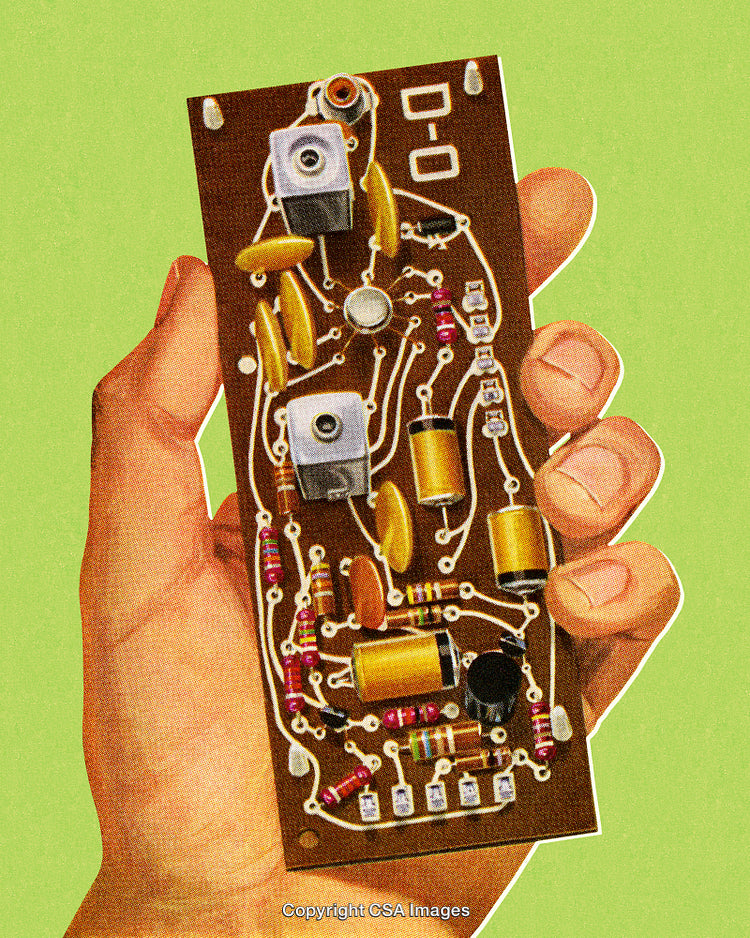 Hand Holding a Circuit Board with Electronic Components on Green Background
