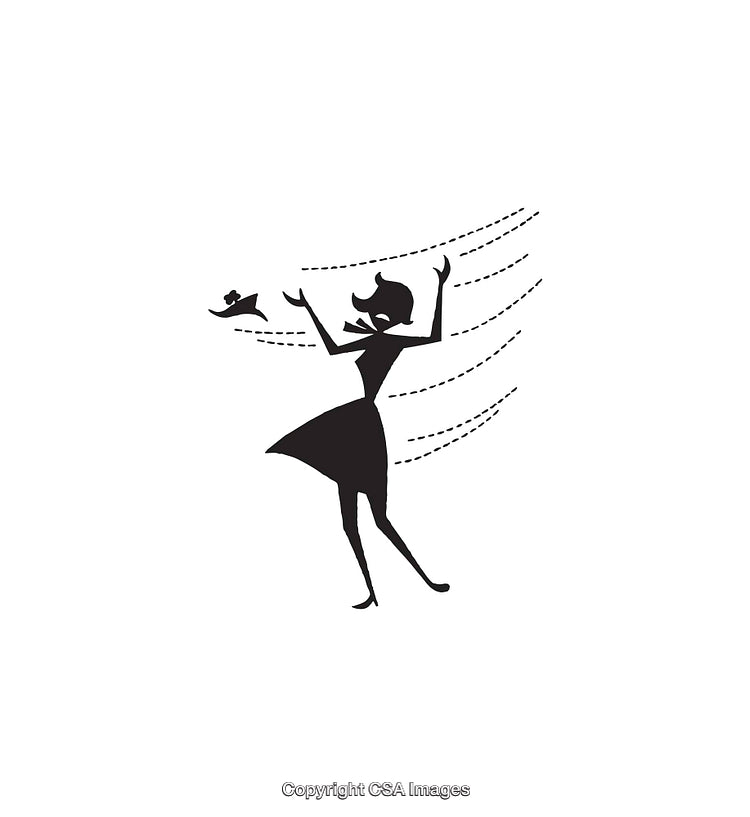 Silhouette of Woman in Wind with Flowing Dress and Hat