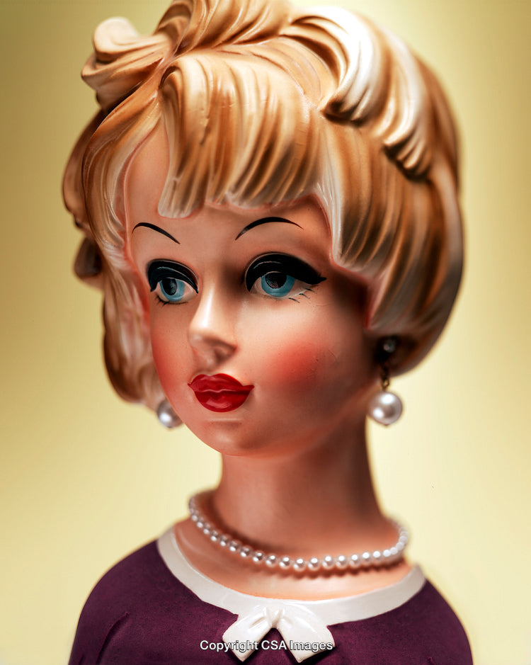 Vintage Ceramic Figurine of a Woman With Elegant Features in Retro Style