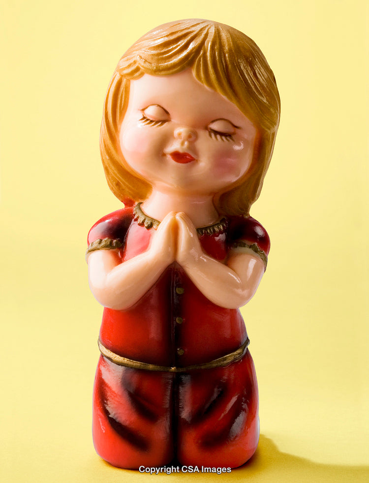 Cute Ceramic Figurine of a Child Praying with Bright Yellow Background