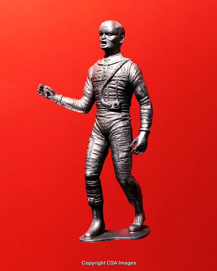 Silver Astronaut Figure Against Bright Red Background with Bold Colors