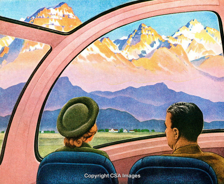 Couple Enjoying Scenic Mountain View Inside a Modern Train Carriage