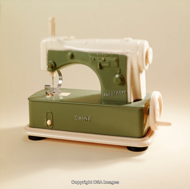 Vintage Toy Sewing Machine with Retro Green and White Design