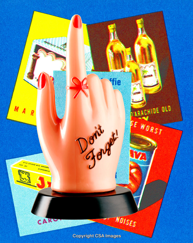 Retro Plastic Toy Hand with Reminder String and Colorful Background