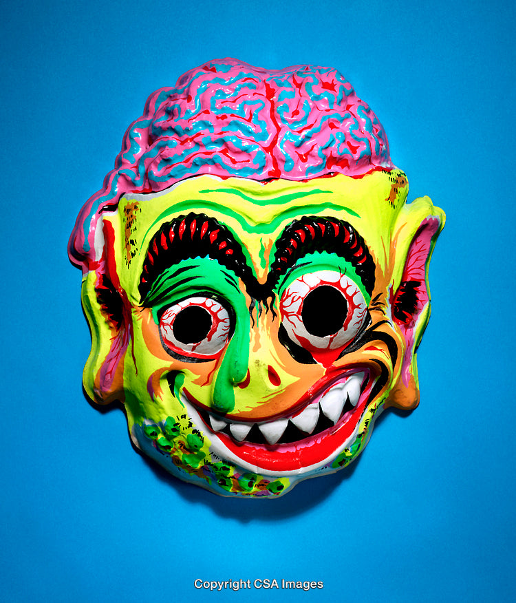 Vividly Colored Grotesque Monster Mask on a Bright Blue Background