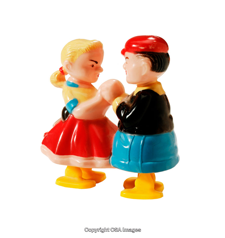 Colorful Plastic Toys Depicting a Dancing Couple Holding Hands