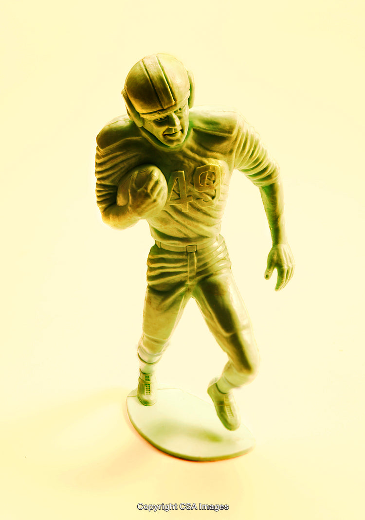 Vintage Green Football Player Figurine in Mid-Action Pose