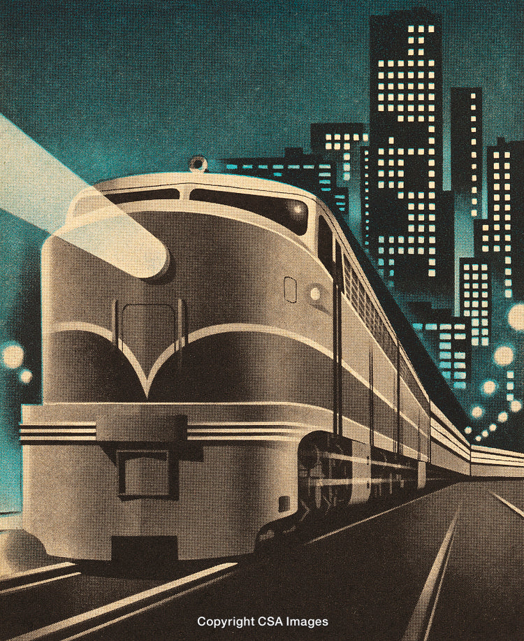 Art Deco Train in Urban Setting During Nighttime Downtown View