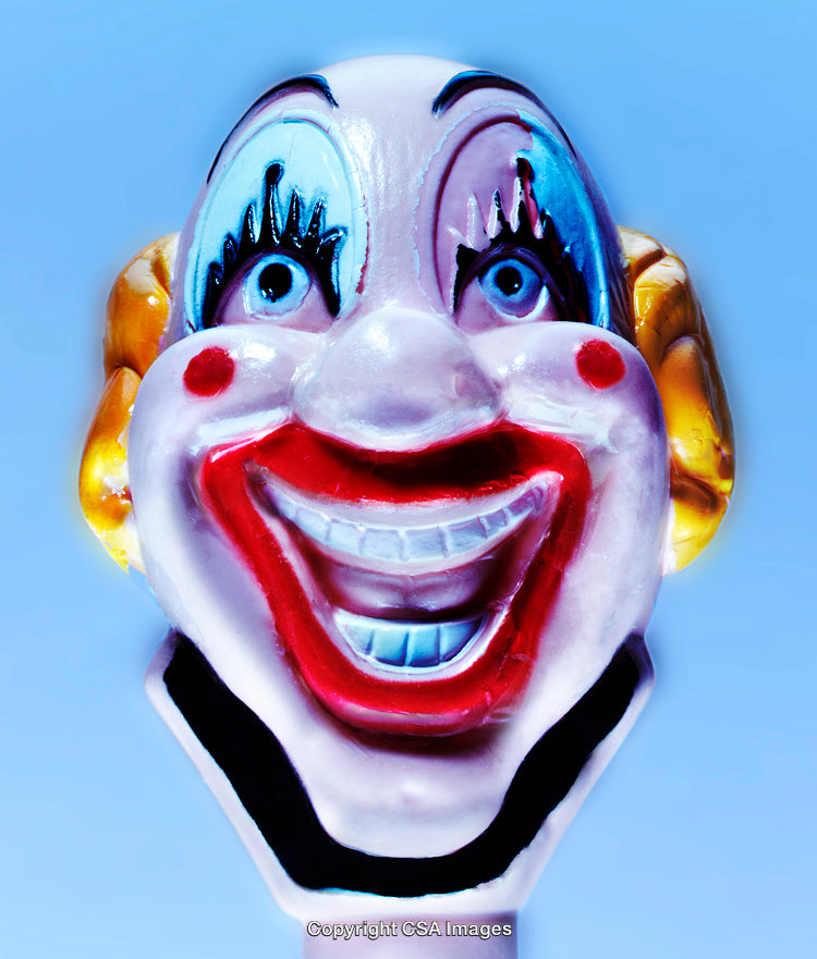 Colorful Plastic Clown Toy Against a Bright Blue Background