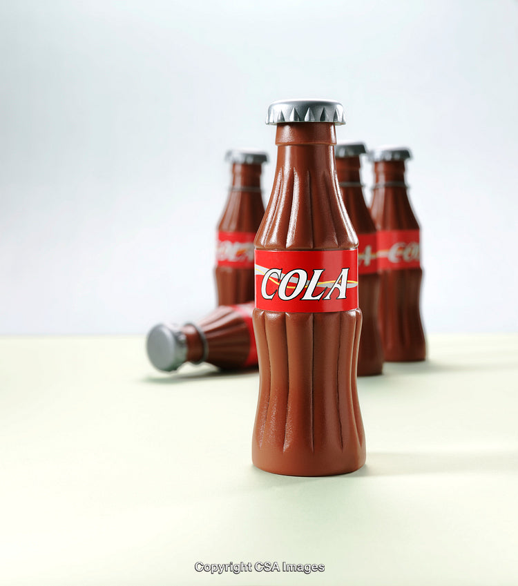 Close-Up of Plastic Cola Bottle Toys in Focus