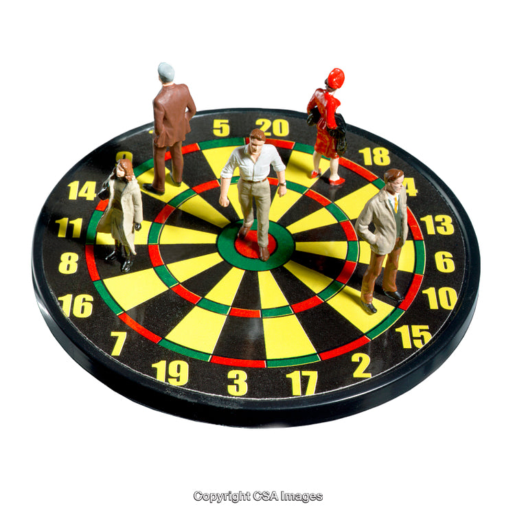 Miniature Figures on Dartboard Representing Teamwork and Strategy in Business