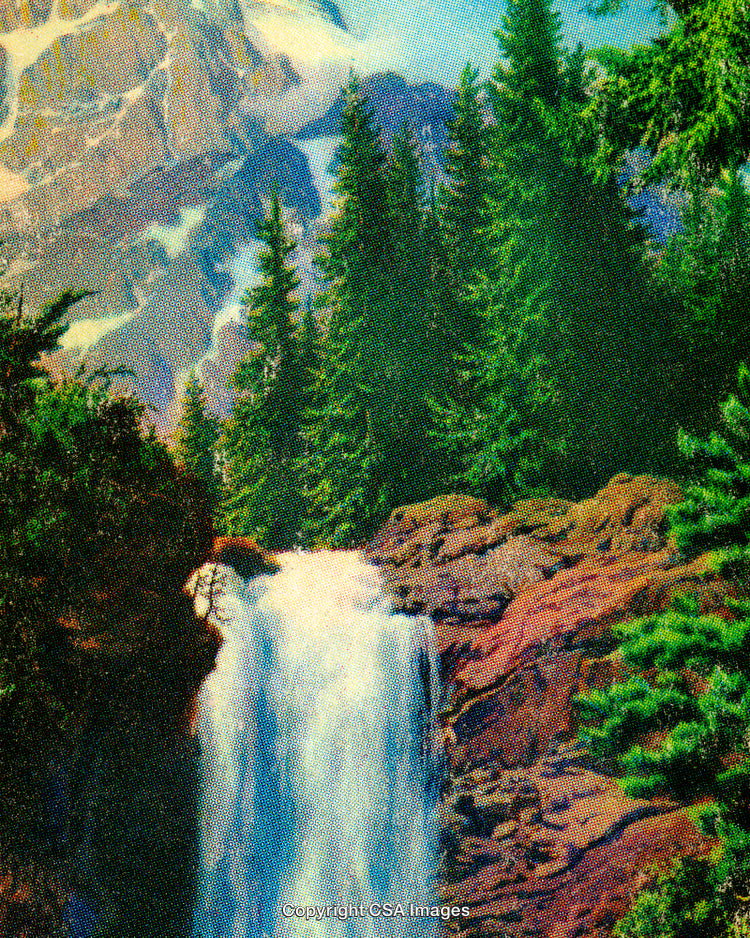 Scenic Waterfall Cascading Amidst Forest With Majestic Mountain As Backdrop