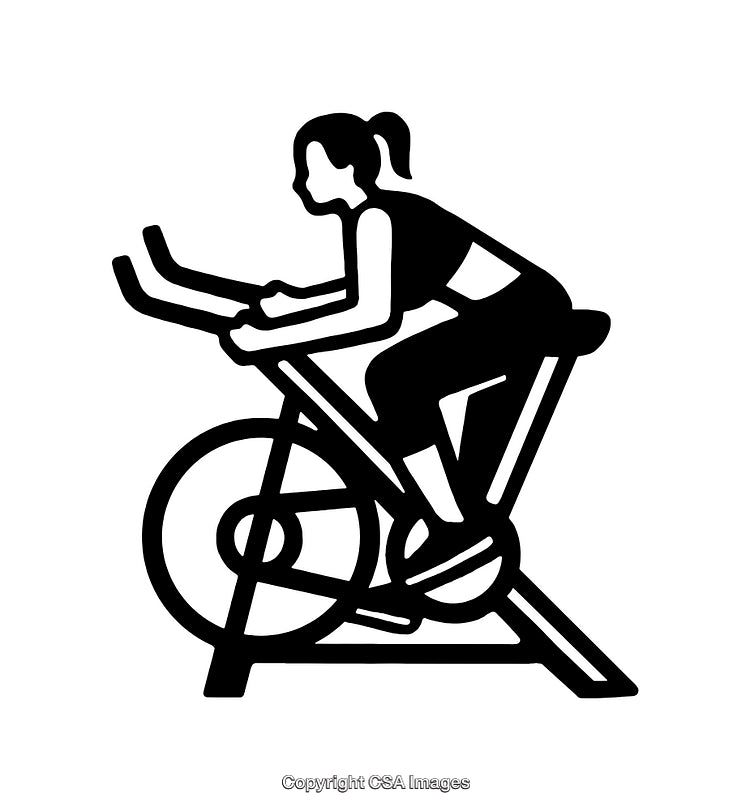 Silhouette of a Woman Exercising on a Stationary Bicycle
