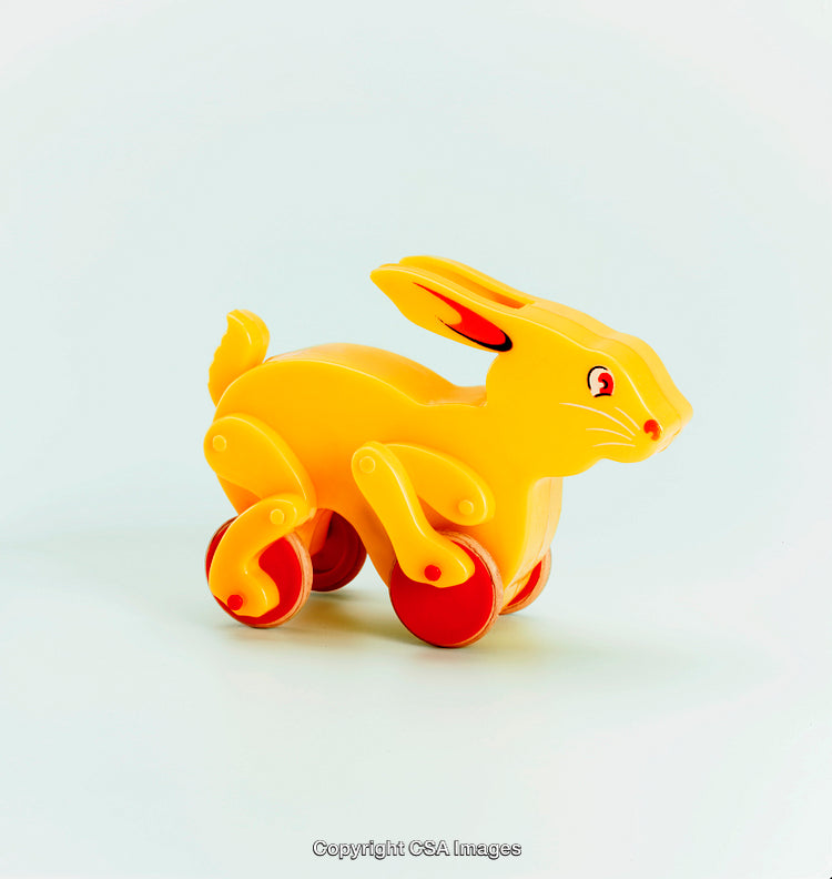Yellow Rabbit Shaped Plastic Toy With Wheels and Playful Design