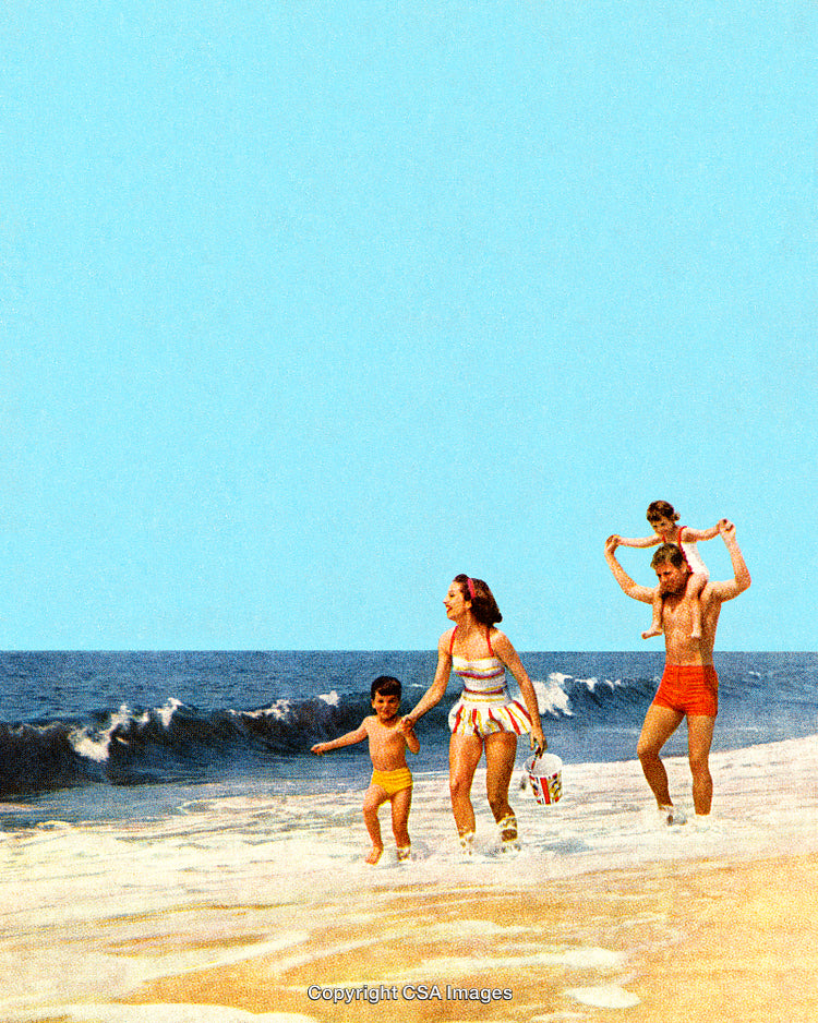 Family Enjoying Quality Time Together By the Ocean Waves at the Beach