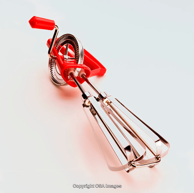 Vintage Kitchen Handheld Egg Beater with Red Handle in Isolated View