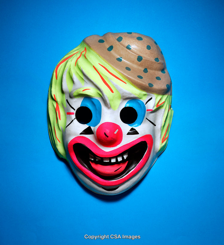 Colorful Clown Mask Displayed Against a Blue Background
