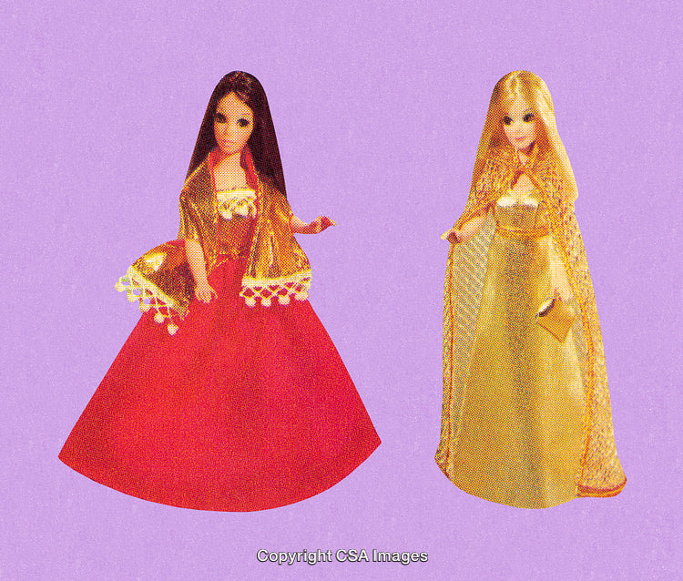 Two Colorful Dolls in Golden Capes Against a Purple Background