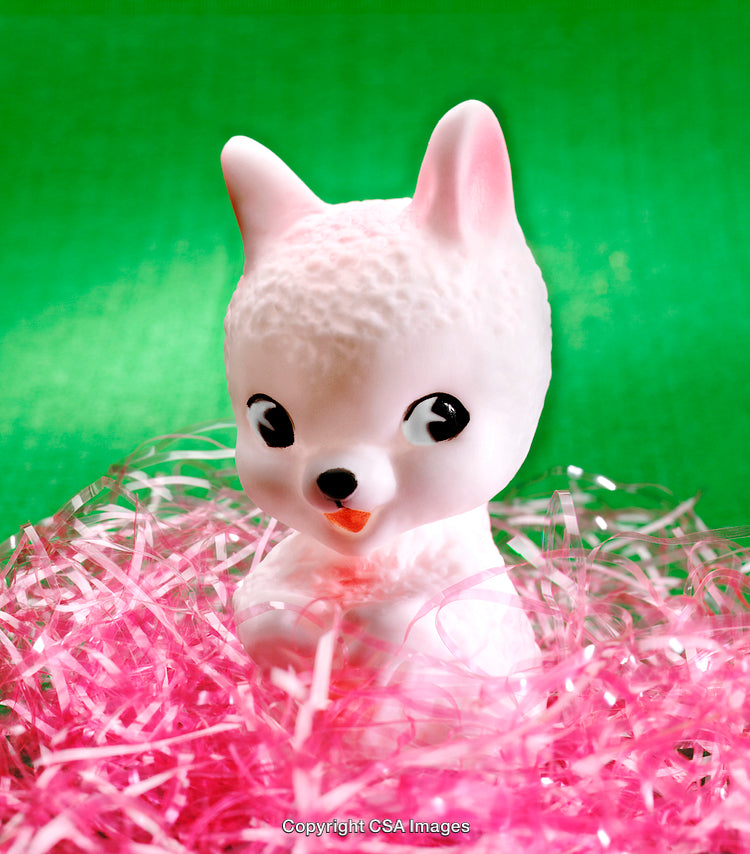 Cute Plastic Toy Animal in Pink Decor with Green Background