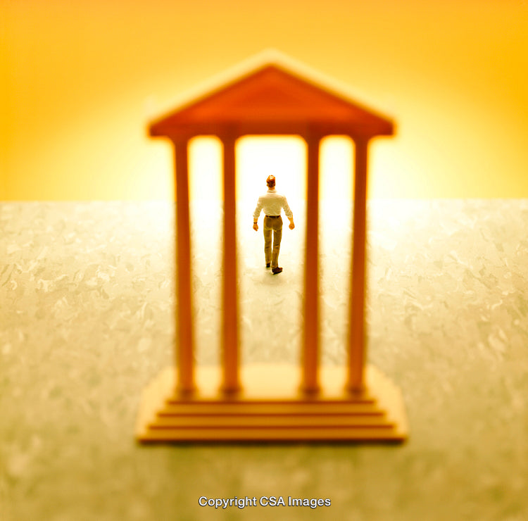 Miniature Figure Walking Through a Small Temple-Like Structure at Golden Hour
