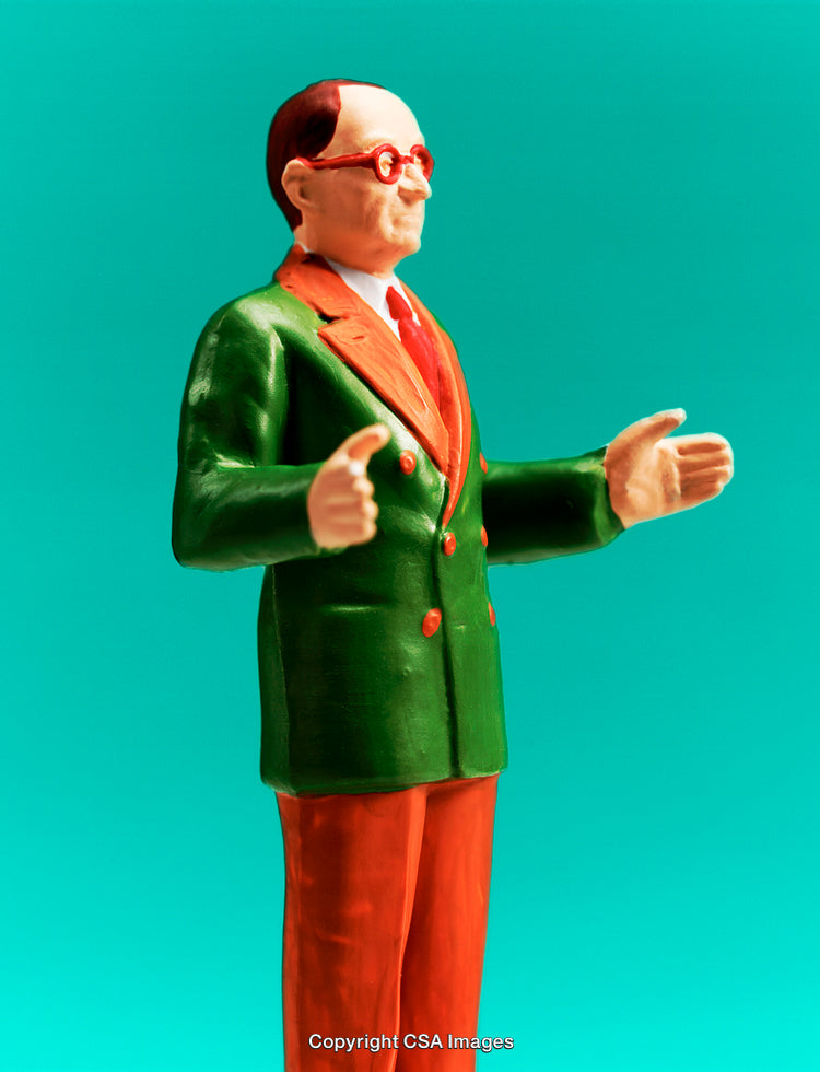 Colorful Plastic Figure of Formal Attired Gentleman on Teal Background
