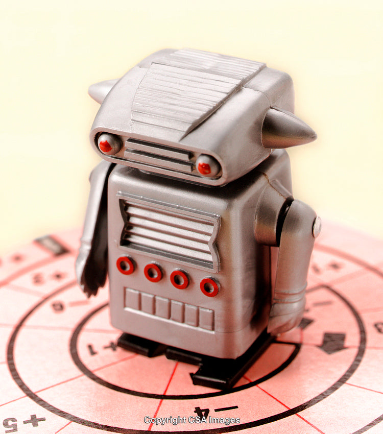 Vintage Robot Toy Figurine On Colorful Game Board Background