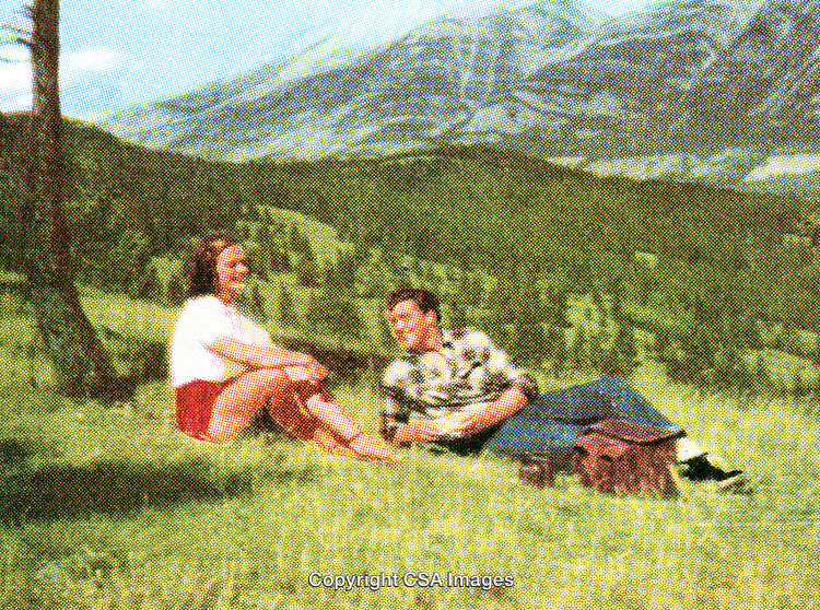Retro Styled Scene of a Couple Relaxing in a Scenic Mountain Meadow