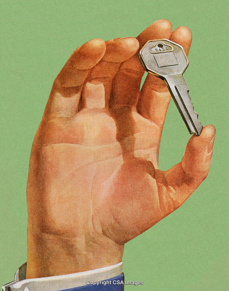 Close-Up of a Hand Holding a Metal Key on a Green Background