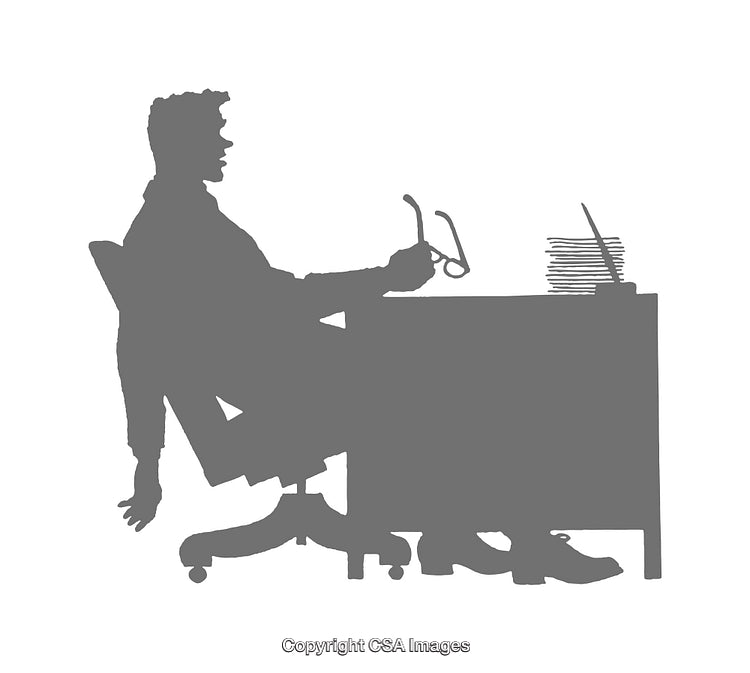 Silhouette of a Person Working at a Desk Holding Glasses