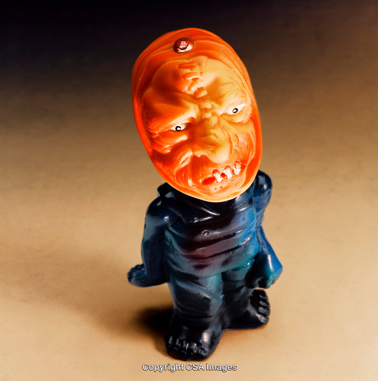 Unique Plastic Toy Featuring an Unusual Face and Artistic Details