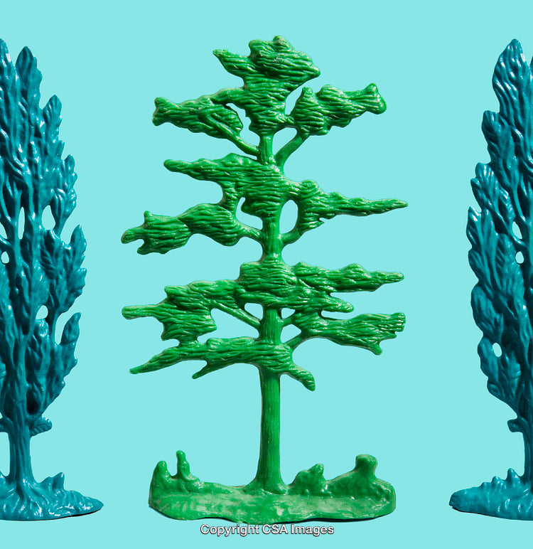 Colorful Plastic Tree Figures on Vibrant Blue Background