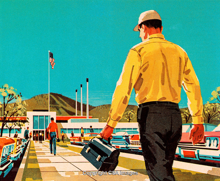 Worker Walking Towards a Factory Building on a Bright Clear Day