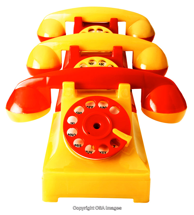 Brightly Colored Vintage-Style Toy Phones Arranged in a Stacked View