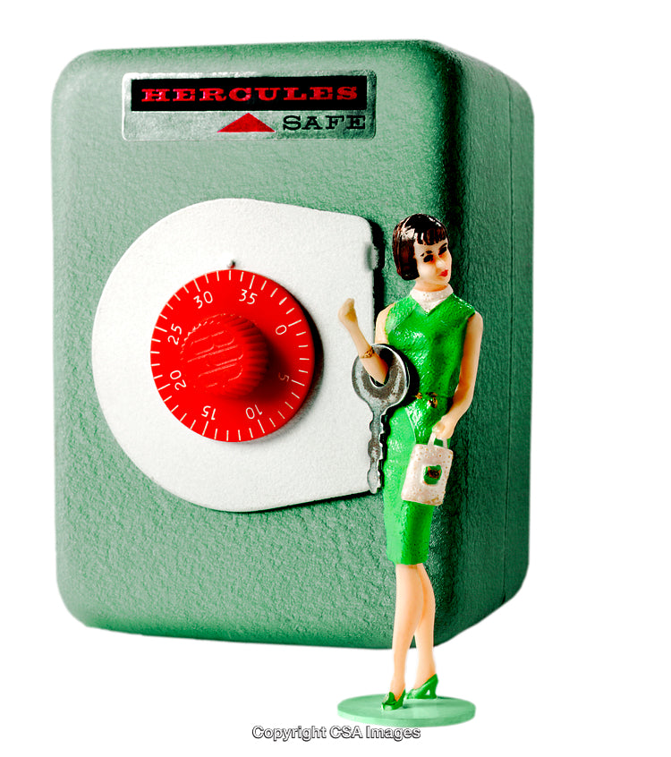 Vintage Toy Safe with Key and Figurine in a Nostalgic Setting