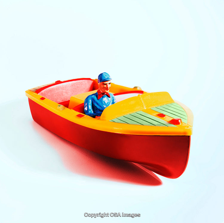 Colorful Toy Boat With Figurine Against White Background