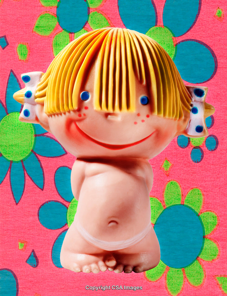 Cute Plastic Doll Figure Against Bright Flower Background