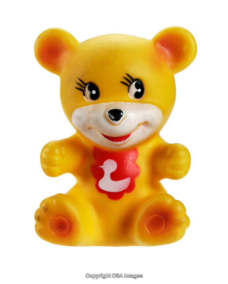 Yellow Toy Bear with Duck Emblem and Smiling Expression Isolated on White