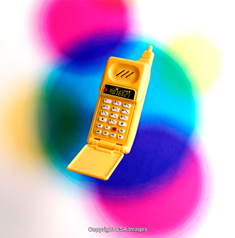 Yellow Toy Flip Phone On Vibrant Colorful Background
