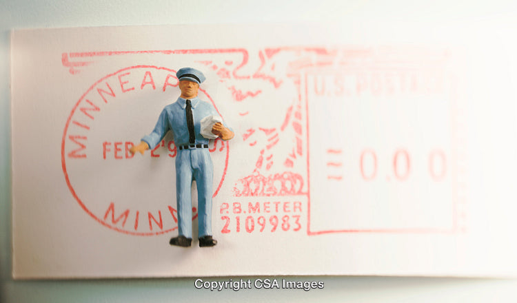 Miniature Mailman Figurine on a Postmarked Stamp Background