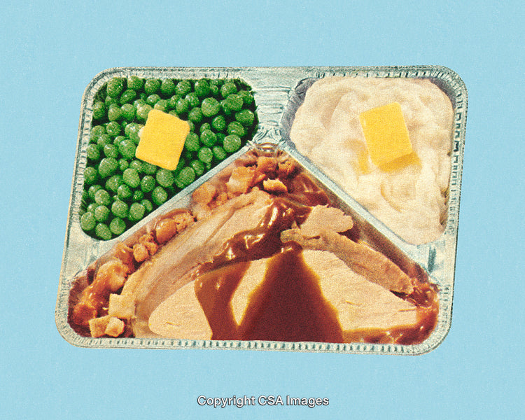 Retro-Style TV Dinner with Classic Comfort Foods on Blue Background