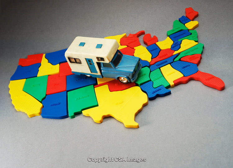 Toy Campervan on Colorful Map of United States Displaying Travel Theme